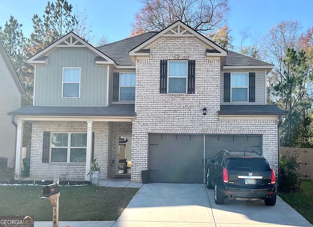 view of front of property featuring a garage and a front yard