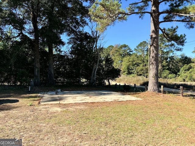 view of yard featuring basketball court