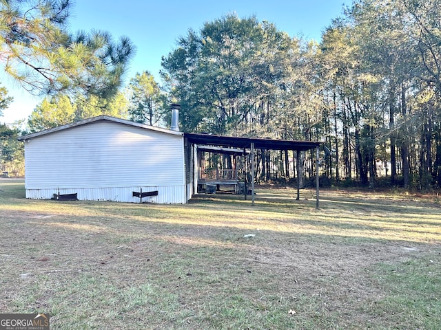 view of side of property with a yard