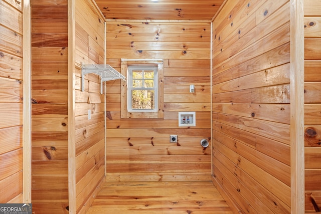 washroom with hookup for a washing machine, wood ceiling, electric dryer hookup, and wood walls