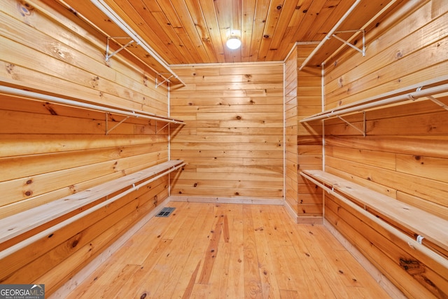 spacious closet with hardwood / wood-style floors