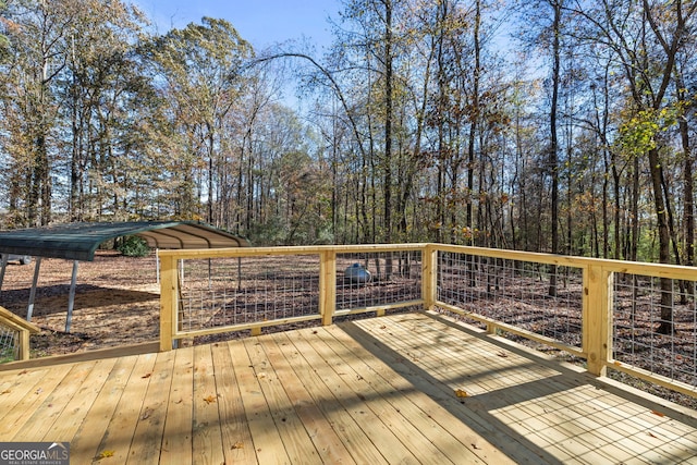 wooden deck with a carport