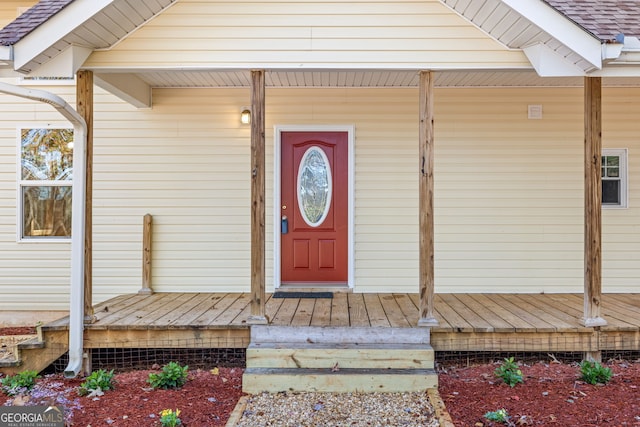 property entrance featuring a porch