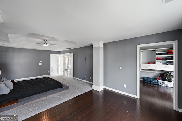 unfurnished bedroom featuring ceiling fan, dark hardwood / wood-style floors, and a closet