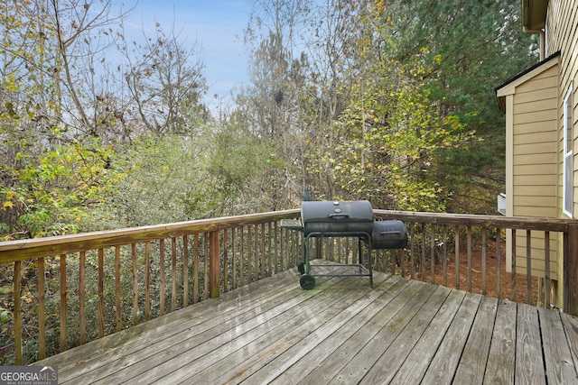 wooden deck featuring grilling area