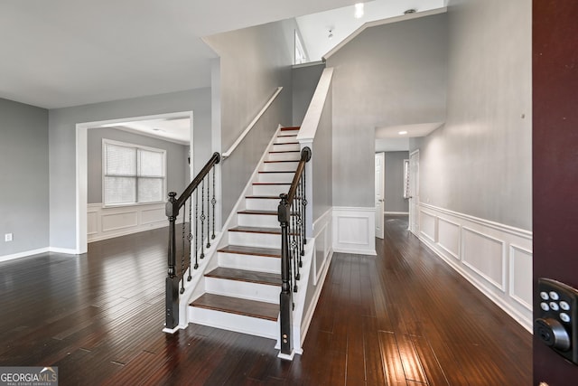 staircase featuring hardwood / wood-style flooring