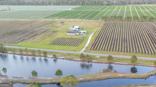 drone / aerial view with a water view and a rural view