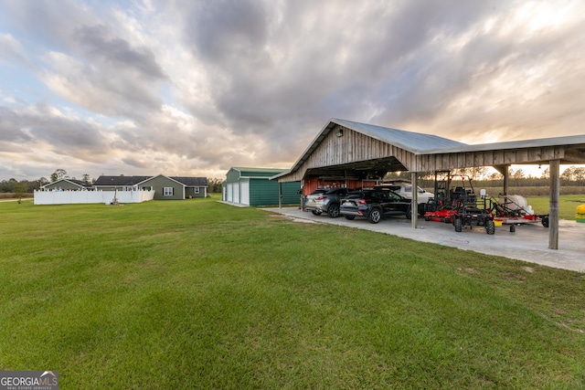 exterior space with a yard and a carport