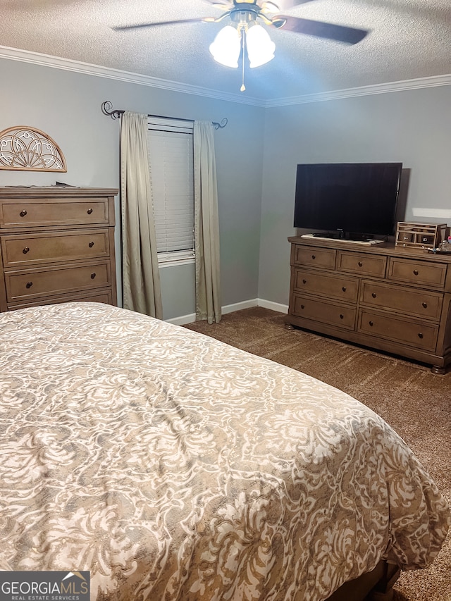 bedroom featuring ceiling fan, crown molding, dark carpet, and a textured ceiling