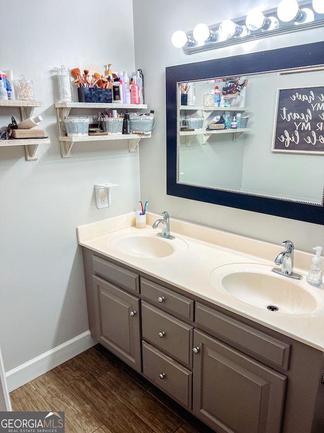 bathroom featuring vanity and wood-type flooring