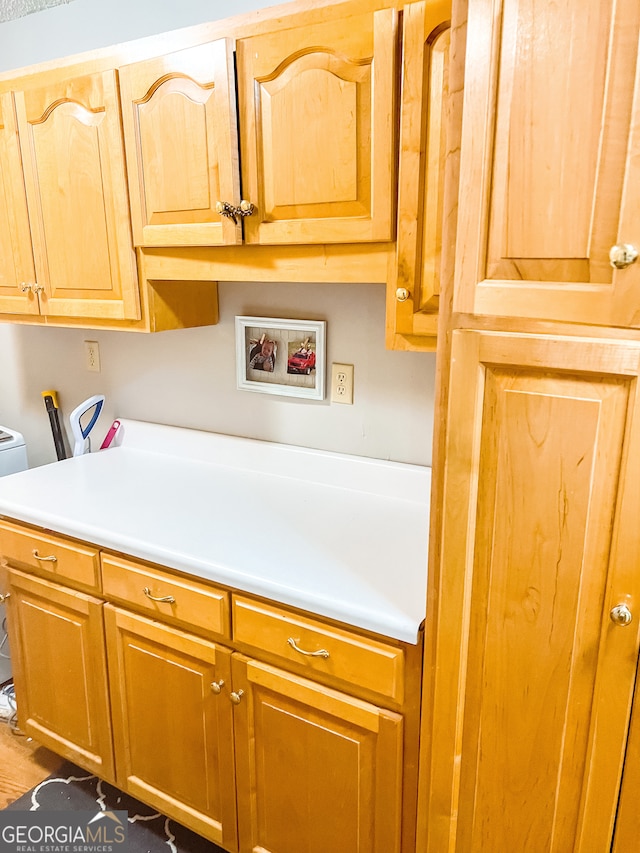 kitchen with dark hardwood / wood-style flooring