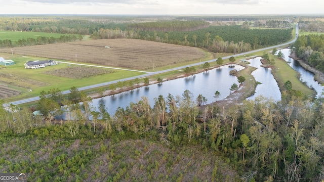 birds eye view of property with a water view and a rural view