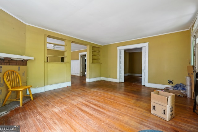 living room with hardwood / wood-style flooring and ornamental molding