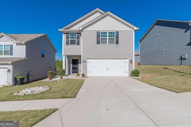 view of front facade with a front yard and a garage