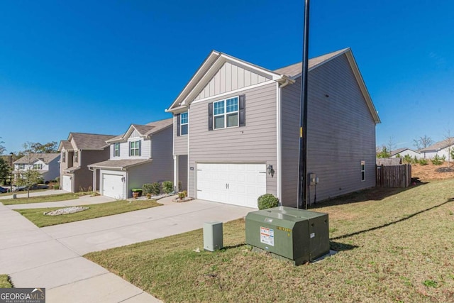 view of front of home with a front yard and a garage