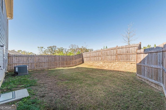 view of yard with central AC