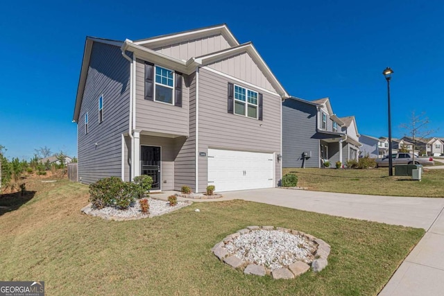 view of front facade with a garage and a front lawn