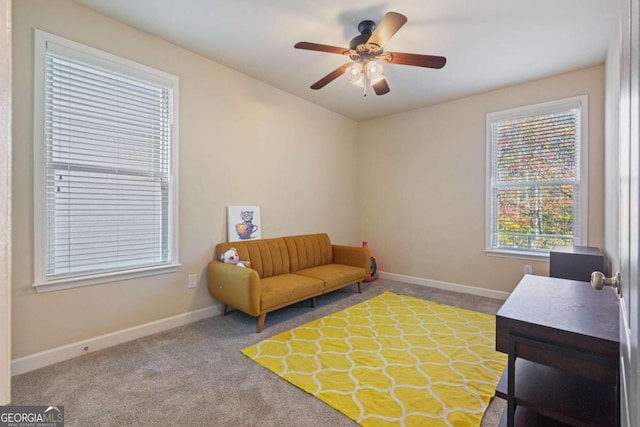 sitting room featuring carpet flooring and ceiling fan