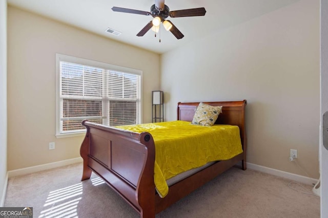 bedroom featuring ceiling fan and light colored carpet