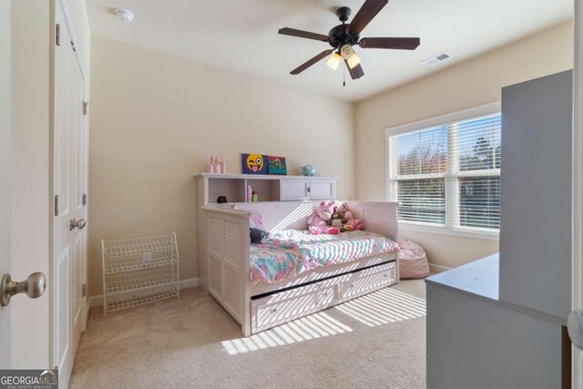 carpeted bedroom with ceiling fan