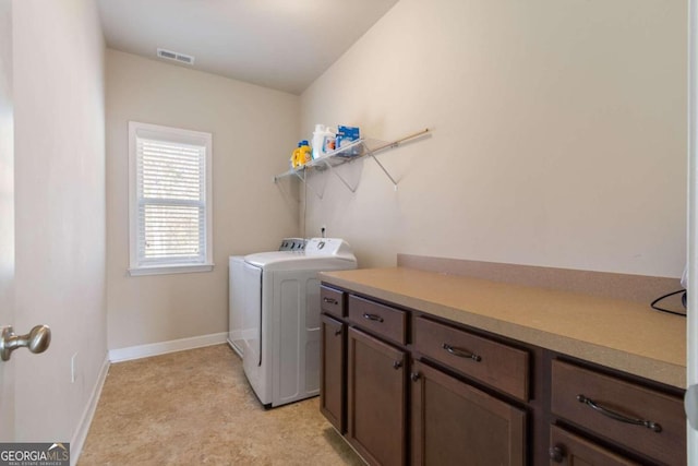 washroom with independent washer and dryer