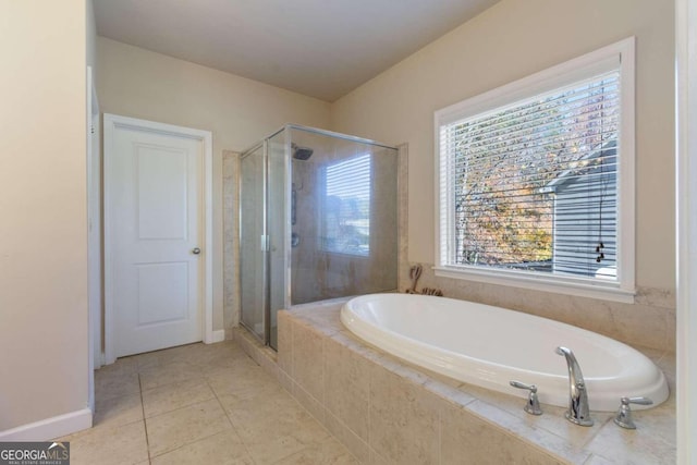 bathroom with tile patterned floors and plus walk in shower