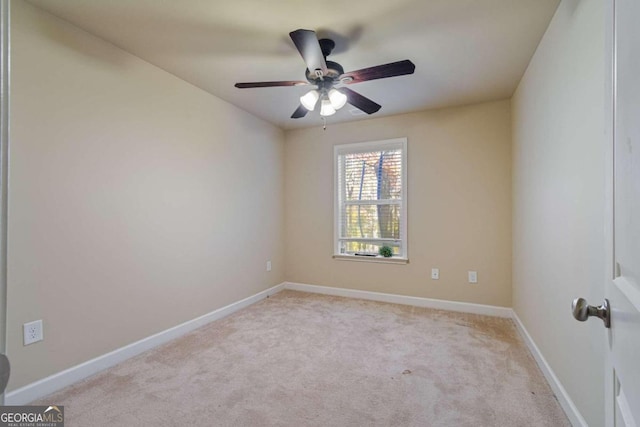 unfurnished room featuring light carpet