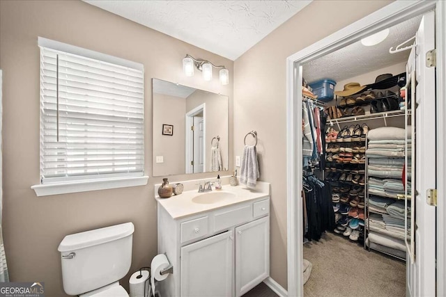 bathroom featuring vanity and a textured ceiling