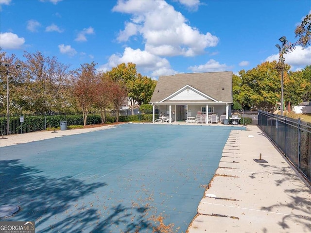 view of swimming pool with a patio area