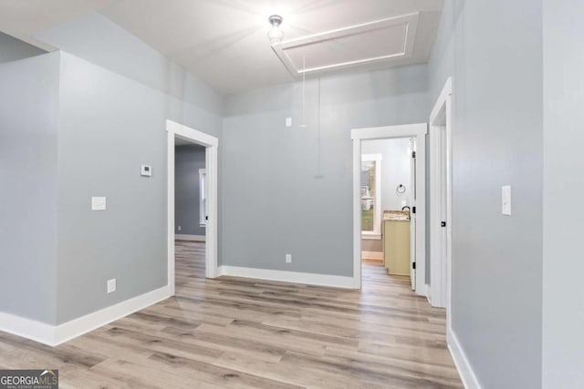 empty room with light hardwood / wood-style flooring