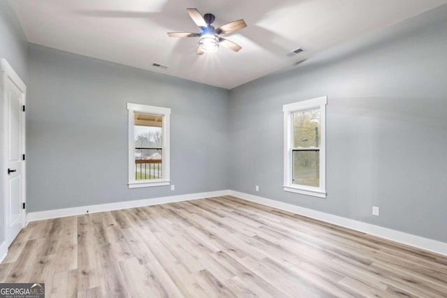 spare room featuring ceiling fan and light wood-type flooring