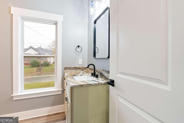 bathroom with vanity and wood-type flooring