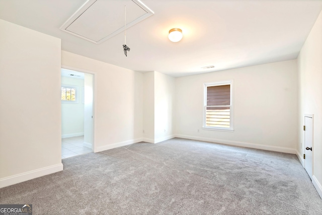 carpeted spare room with a wealth of natural light