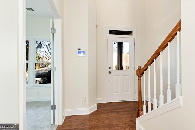 entrance foyer featuring dark hardwood / wood-style flooring