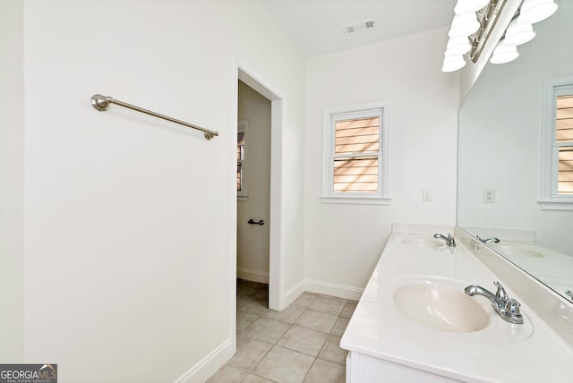 bathroom featuring tile patterned flooring and vanity