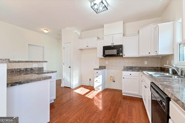 kitchen featuring decorative backsplash, sink, black appliances, white cabinets, and dark hardwood / wood-style floors