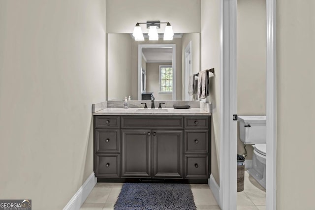 bathroom featuring tile patterned floors, vanity, and toilet