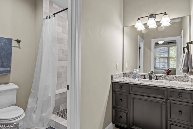 bathroom with a shower with curtain, toilet, and vanity