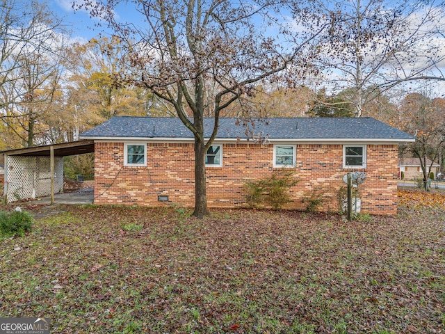 view of side of property featuring a carport