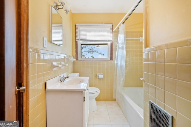 full bathroom featuring vanity, tile patterned floors, and tile walls