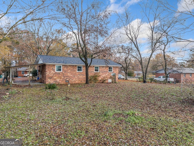 view of side of property with a patio