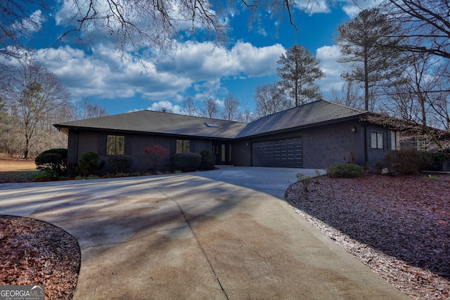 ranch-style house featuring a garage