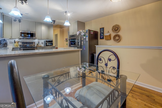 dining area with light hardwood / wood-style floors