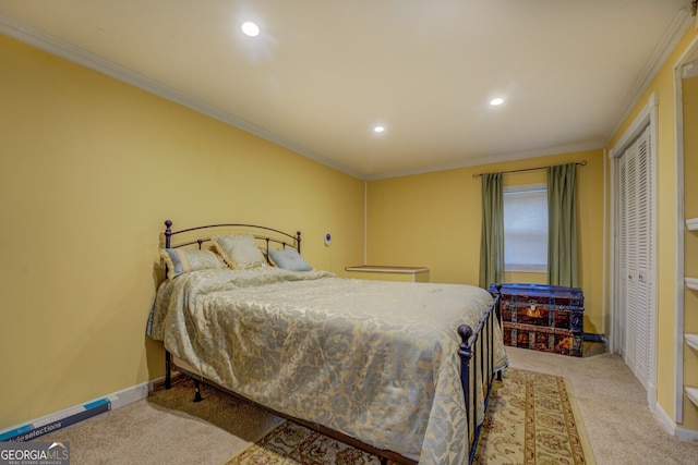 carpeted bedroom featuring a closet and ornamental molding