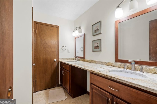 bathroom with vanity and tile patterned floors