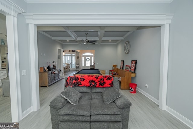 living room with beamed ceiling, ceiling fan, light wood-type flooring, and coffered ceiling