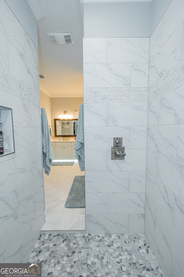 bathroom with tiled shower