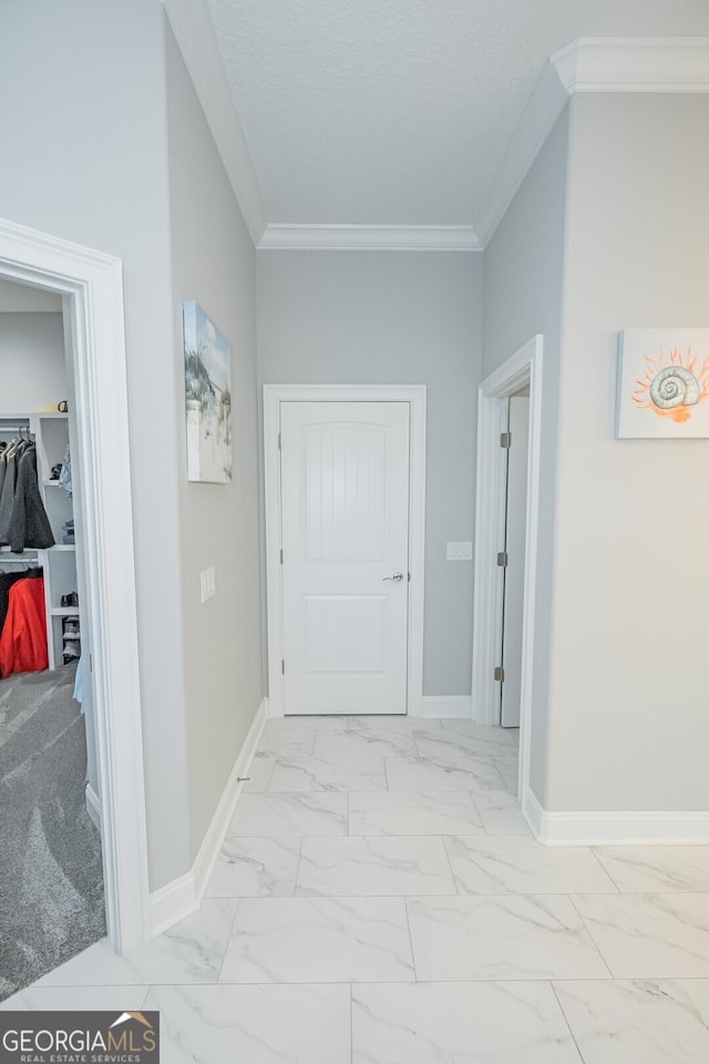 hall featuring light colored carpet and crown molding