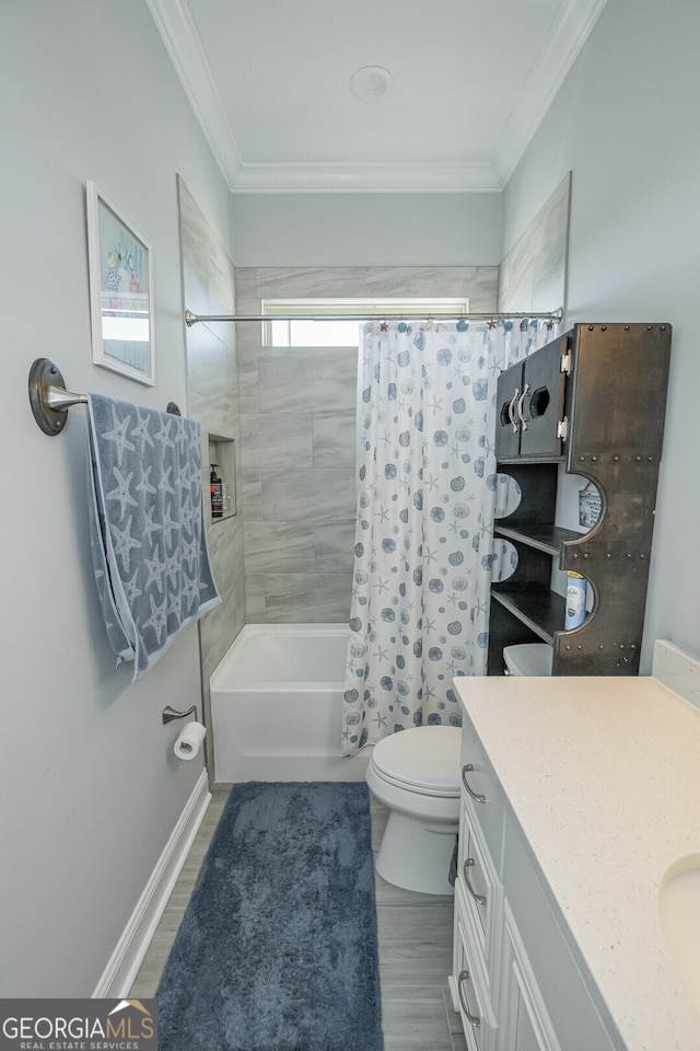 full bathroom featuring crown molding, hardwood / wood-style floors, toilet, shower / tub combo with curtain, and vanity