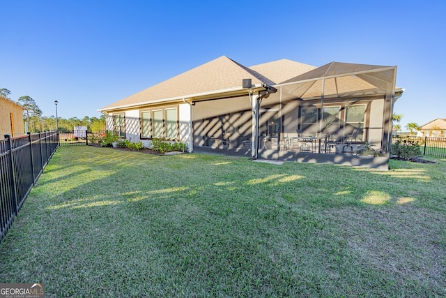 view of yard featuring a patio area and a lanai